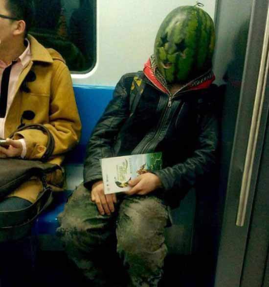 [Image: man-subway-bus-watermelon-head-public-tr...tation.jpg]